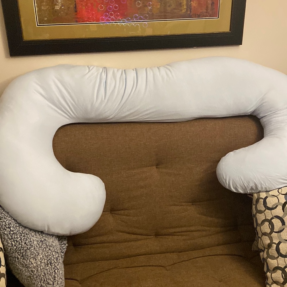 Pastel blue body pillow. New, barley used. One night slept.